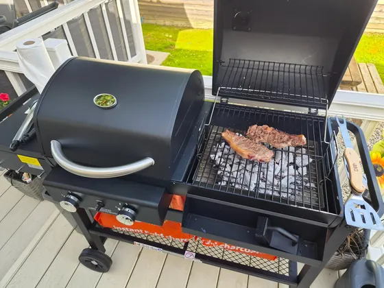 Charcoal barbecue in use on the private decking at Fox Hole Retreat.