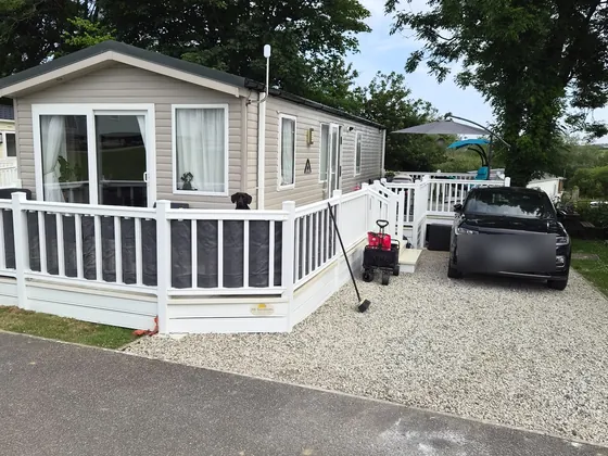 Front view of Fox Hole Retreat with decking and easy parking.